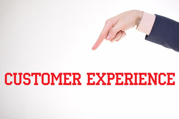 A businessman shows an inscription:CUSTOMER EXPERIENCE