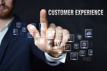 A businessman shows an inscription:CUSTOMER EXPERIENCE
