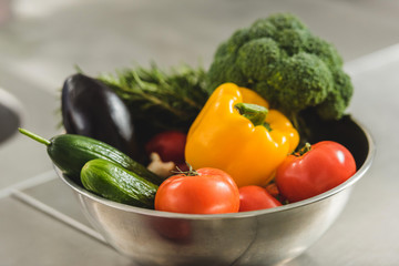 bowl of ripe organic vegetables on table