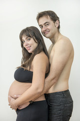 Pregnant woman posing with her husband