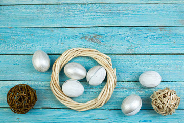 Happy Easter. eggs on wooden table background.. Balls, wreath woven from the vines. Copy space for text. Top view.