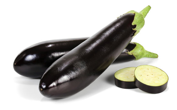 Two unpeeled eggplant or aubergine vegetable and two slices isolated on white background.