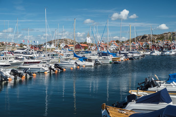 Pier with parked yachts in the marine town on the Southern cost of Sweden.