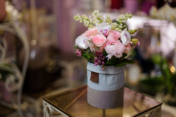 Beautiful blue violet vintage box of pink roses and another flowers