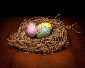 Easter eggs in dry straw nest