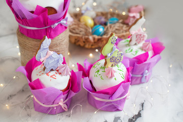 Easter composition with orthodox sweet bread, kulich and eggs on light background. Easter holidays breakfast concept with copy space.
