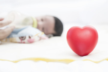 Obraz na płótnie Canvas Red heart and baby newborn..
