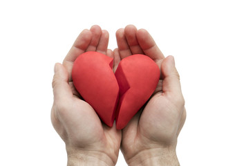 Fototapeta premium Złamane serce w rękach na białym tle biały ze ścieżką przycinającą
