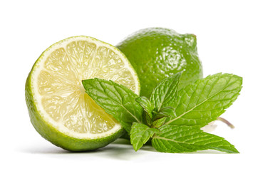  one lime with half of a juicy lime with leaves of mint isolated on white background