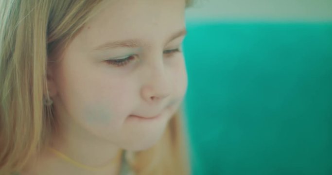 little baby girl doing makeup, slow motion