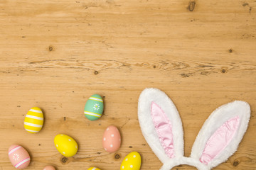 Easter holiday background with bunny ears and easter eggs