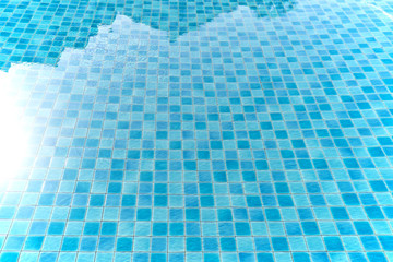 Sun reflection over water of swimming pool