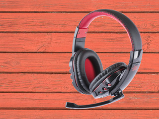 stereo headphones on a wooden background. 
