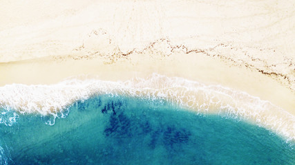 Beautiful tropical empty beach and sea waves. Aerial view.