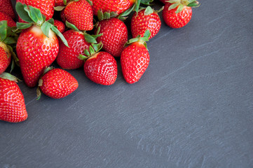 Fresh strawberries on a gray background with copy space