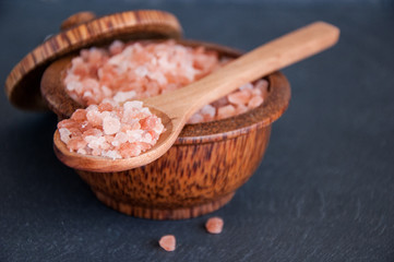 Pink Himalayan salt on a gray background