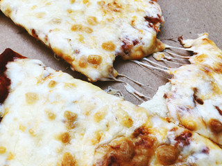 Delivery box with delicious pizza. Pizza to order. Pizza in a cardboard box