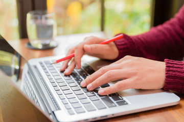 Obraz na płótnie Canvas Soft focus Closeup woman hand working on her laptop. Social networking technology concept.