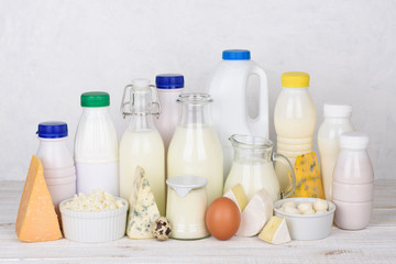 Big set of dairy products on white wooden table still life