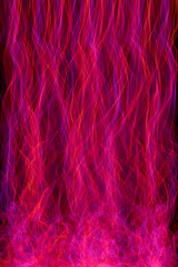 Obraz premium Multi color abstract light painting. LED lights on black background