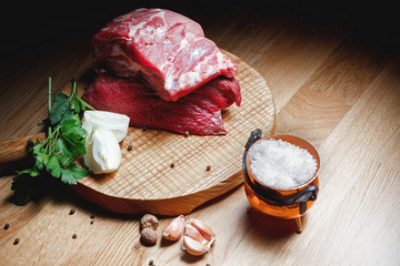 Raw beef meat on  wooden board.