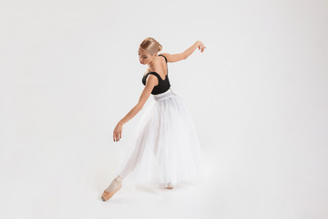 Fototapeta na wymiar Full-lenght portrait of talented young woman ballerina