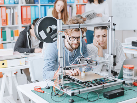 Students using a 3D printer