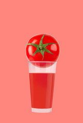 Glass of tomato juice with tomato