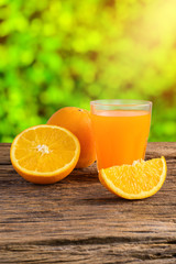 Glass of Fresh Orange Juice on grunge wooden table