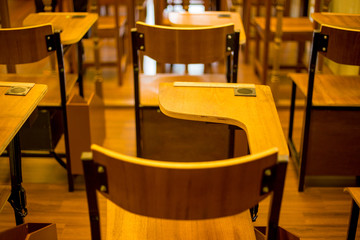 Classic classroom chair with arm bar by nobody in class use for lecture or education
