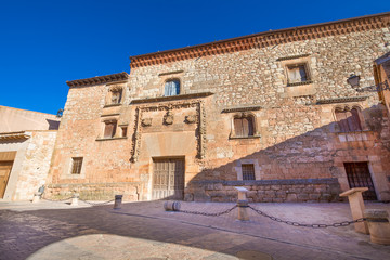 Fototapeta na wymiar exterior facade of Palace Contreras, landmark and public monument of fifteenth century, in old town of Ayllon village, Segovia, Spain, Europe 