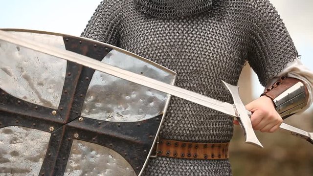 armed knight with a sword and shield