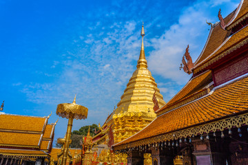 Fototapeta premium golden pagoda in wat Phrathat Doi Suthep under blue sky.Temple is tourist attraction of Chiang Mai, Thailand.