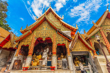 golden pagoda in wat Phrathat Doi Suthep under blue sky.Temple is tourist attraction of Chiang Mai, Thailand.