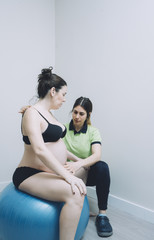 Pregnant woman at the physiotherapist