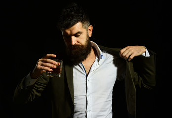 Drinking and alcohol concept. Man with thoughtful face in suit