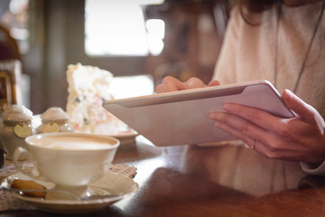 Woman using tablet in the cafe