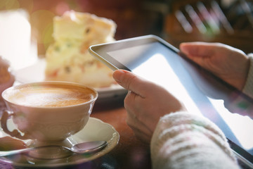 Woman using tablet in the cafe