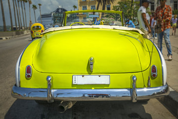 Yellow Cuban vintage car in Havana 