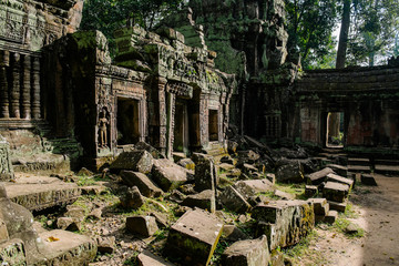 Angkor wat - one of the temples in the khmer complex with roots and trees over the walls - Siem Reap, Cambodia