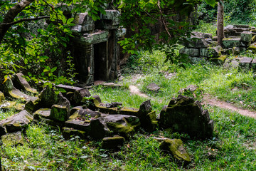 Angkor wat - one of the temples in the khmer complex with roots and trees over the walls - Siem Reap, Cambodia