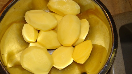 Peeled raw potatoes.
