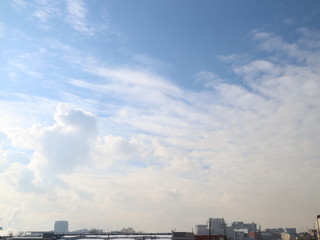 Fototapeta na wymiar cumulus clouds in the winter sky