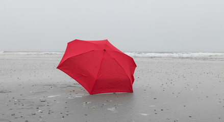 Red umbrella at the beach