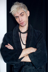 Handsome guy model bissexual with beads around his neck