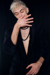 Handsome guy model bissexual with beads around his neck