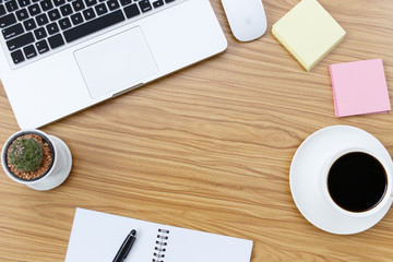 Office desk table with laptop,smartphone and coffee cup and accessories. Business desk with a keyboard, mouse and pen on white table. Top view of workplace
