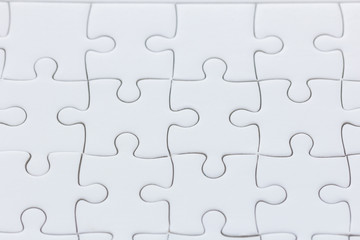 close up White jigsaw puzzle background texture