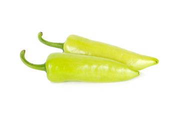 fresh green chili peppers with stem on white background