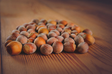  Walnuts and hazelnuts on a brown wooden table for a healthy lifestyle